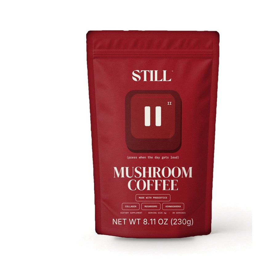 Front of the red STILL Mushroom Coffee pouch