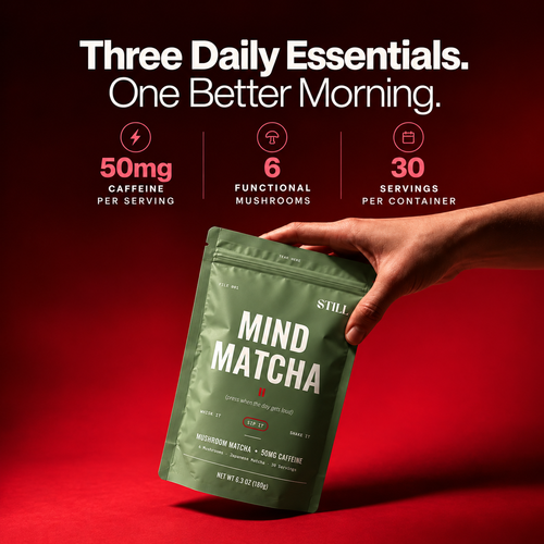 Hand holding a STILL Mushroom Matcha pouch: Three daily essentials, one better morning. 50mg caffeine, 6 functional mushrooms, 30 servings