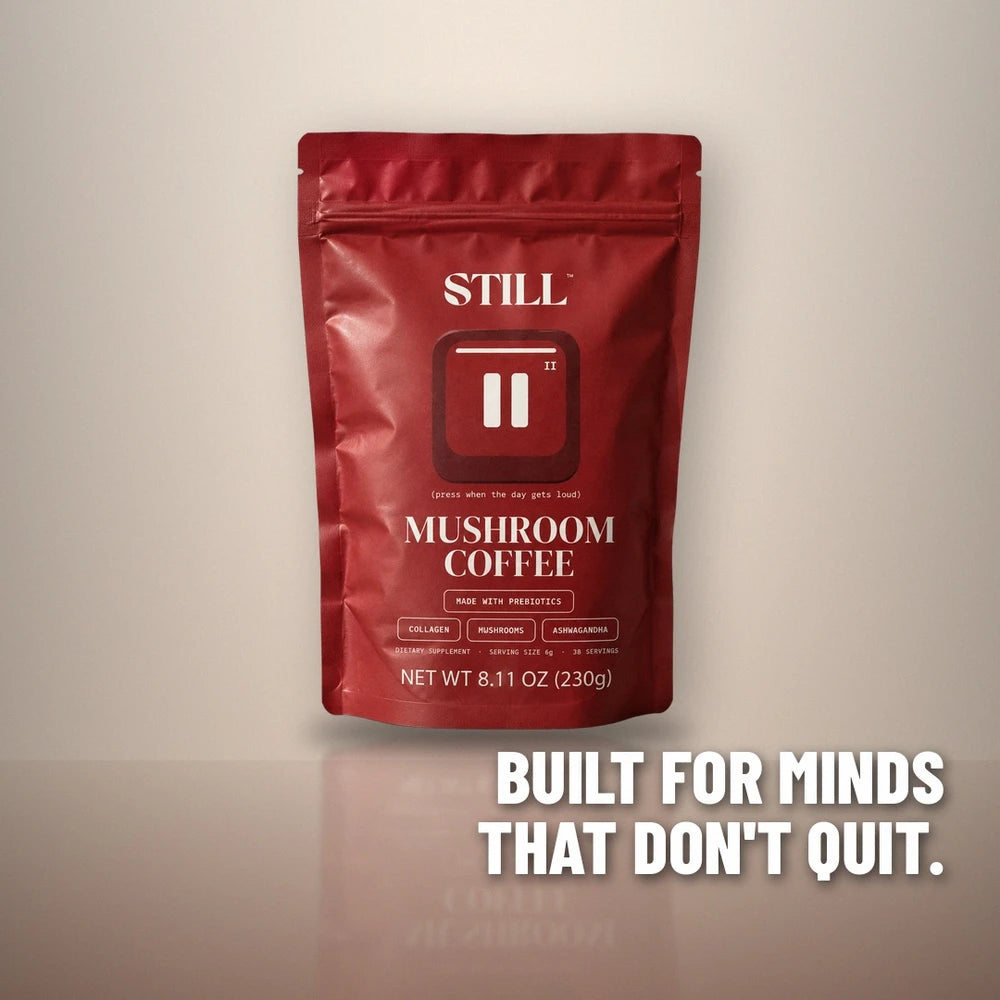 STILL Mushroom Coffee red pouch in a studio: Built for minds that don't quit